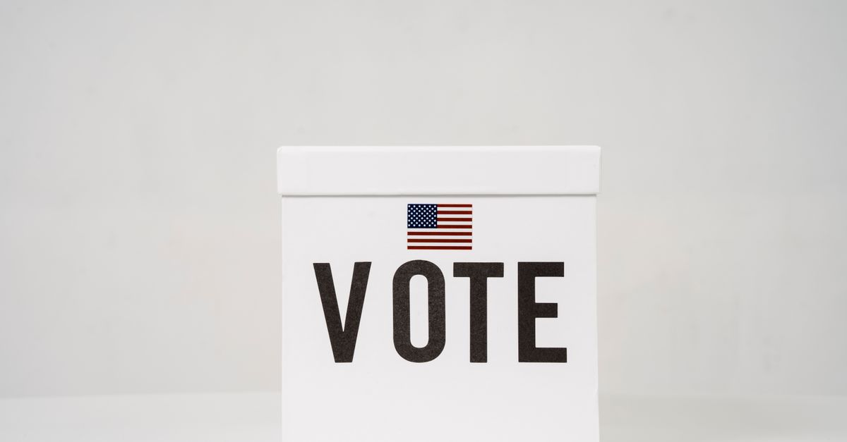 A minimalist ballot box with 'Vote' and an American flag, symbolizing elections.